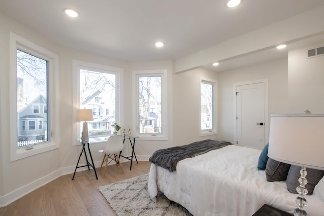 bedroom with light hardwood / wood-style flooring