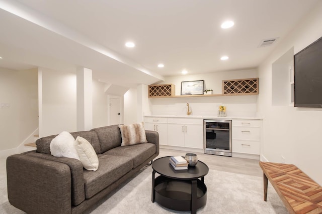 living room with beverage cooler and indoor wet bar