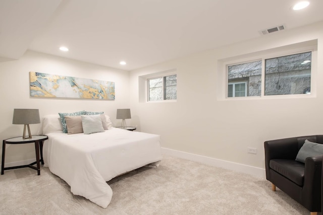 bedroom with light carpet