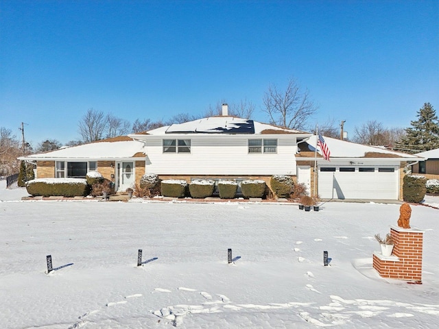 split level home featuring a garage