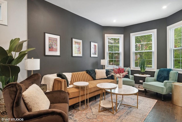 living area with recessed lighting and wood finished floors