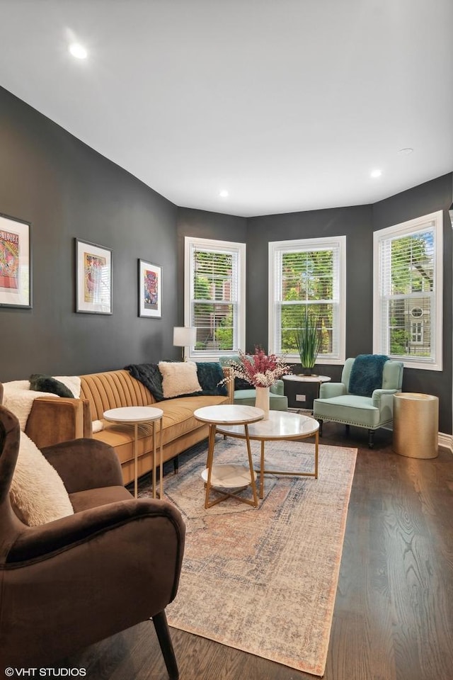 living area with recessed lighting, plenty of natural light, and wood finished floors