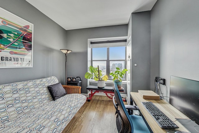 bedroom featuring wood finished floors