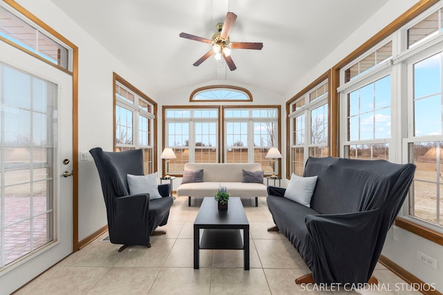 living room with vaulted ceiling, a healthy amount of sunlight, light tile patterned floors, and ceiling fan