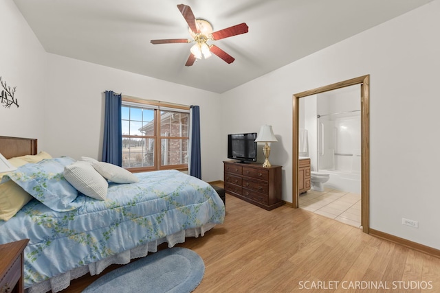 bedroom with ensuite bath, light hardwood / wood-style floors, and ceiling fan