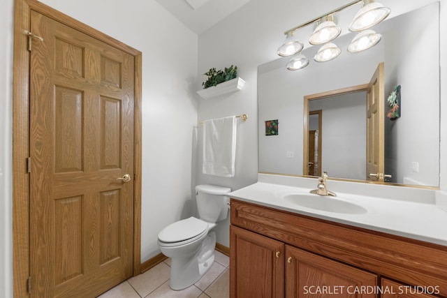 bathroom featuring vanity, toilet, and tile patterned flooring