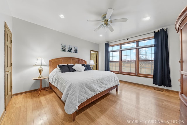 bedroom featuring light hardwood / wood-style floors and ceiling fan