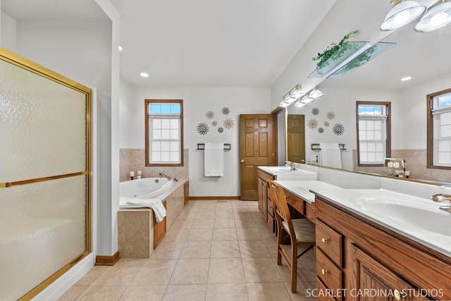 bathroom featuring tile patterned floors, shower with separate bathtub, and vanity