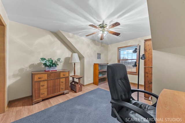 home office with ceiling fan and light wood-type flooring