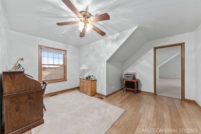 office space featuring ceiling fan and light hardwood / wood-style floors