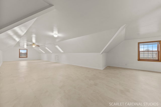 bonus room with vaulted ceiling and ceiling fan