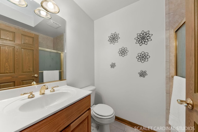 bathroom with vanity, an enclosed shower, tile patterned floors, and toilet