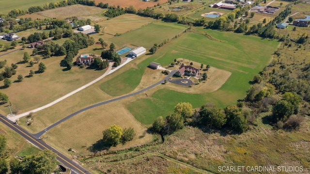 birds eye view of property with a rural view