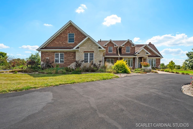 craftsman-style home with a front yard