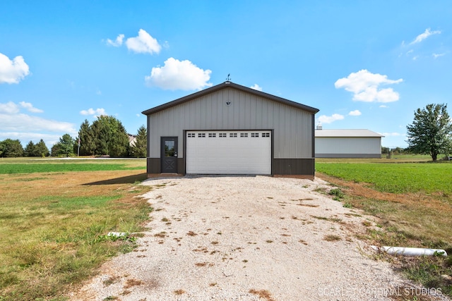 garage featuring a yard