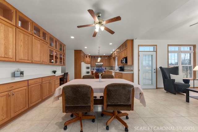 tiled dining area featuring ceiling fan