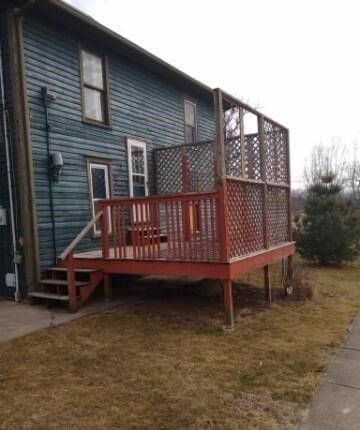 rear view of property with a wooden deck