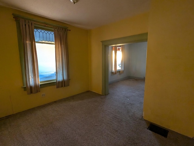 empty room with carpet flooring