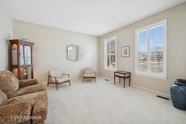 living area with light colored carpet