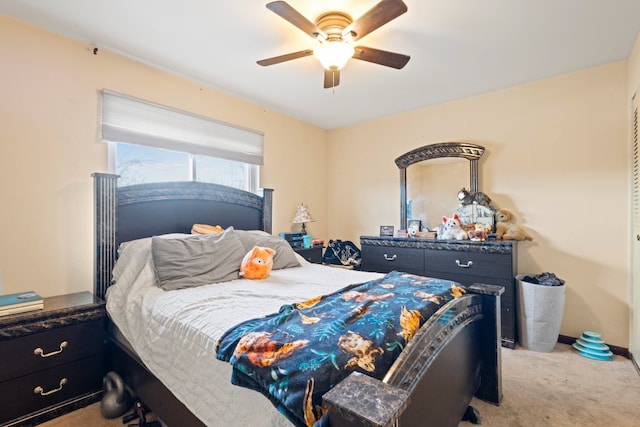 bedroom with light carpet, ceiling fan, and baseboards