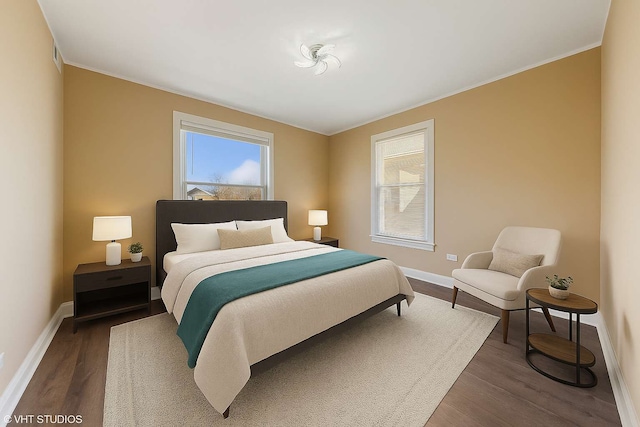 7121 S Yale Ave, Chicago, IL 60621 - bedroom with multiple windows, wood finished floors, and ornamental molding
