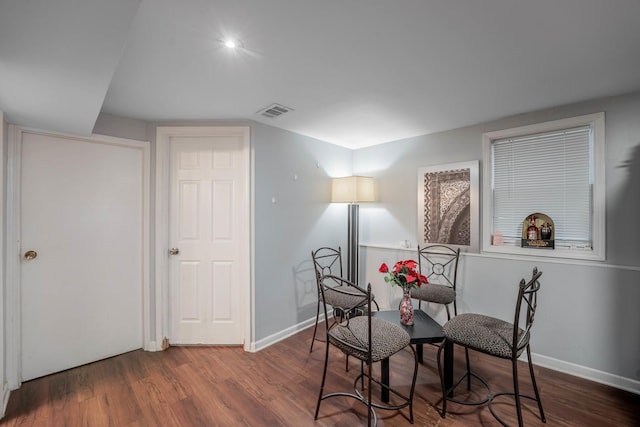 sitting room with dark hardwood / wood-style flooring