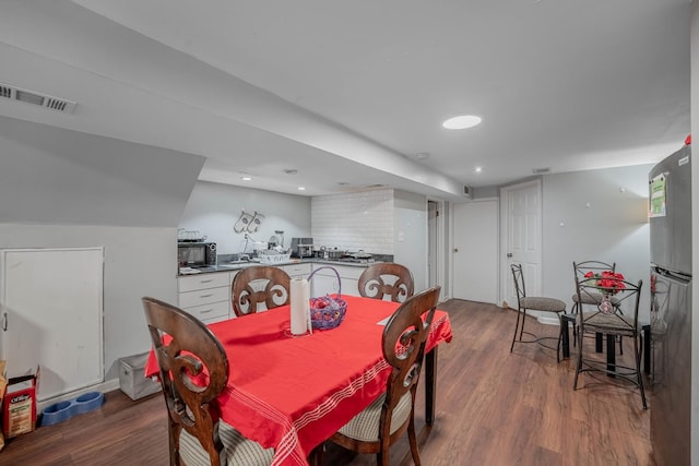 dining room with dark wood-type flooring