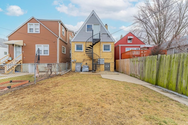 back of house with a yard and a patio area