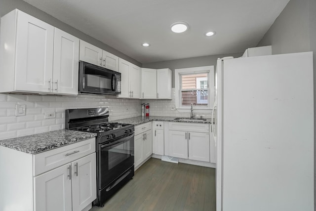 kitchen featuring white cabinetry, sink, black appliances, and light stone countertops