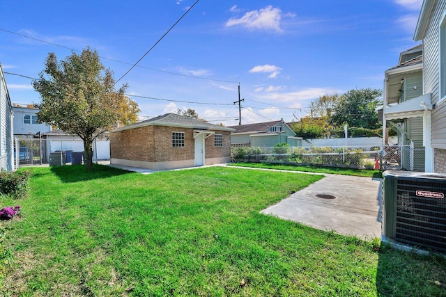 view of yard with a patio and central air condition unit