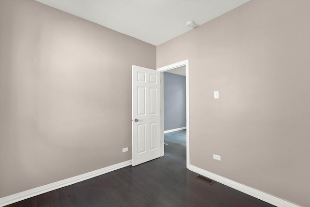 unfurnished room featuring dark hardwood / wood-style floors