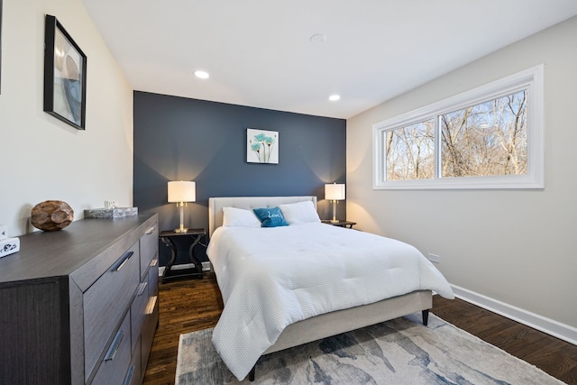 bedroom with dark wood-type flooring