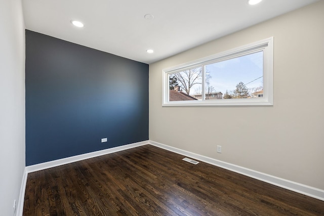 empty room featuring hardwood / wood-style floors