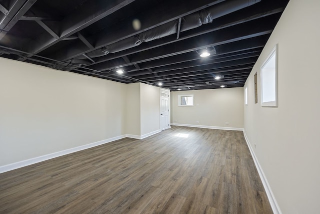 basement featuring hardwood / wood-style floors