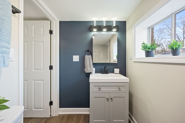 bathroom with vanity and hardwood / wood-style floors