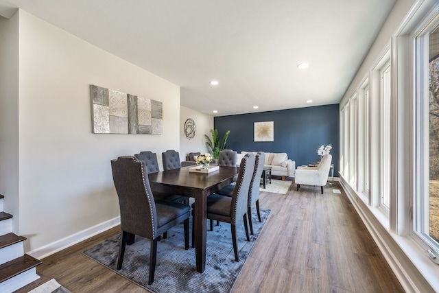 dining area with dark hardwood / wood-style flooring