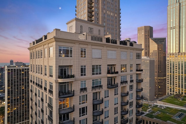 view of outdoor building at dusk