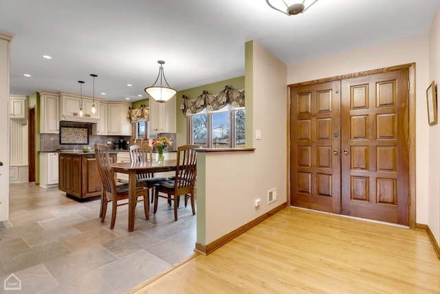 dining area with light wood-type flooring