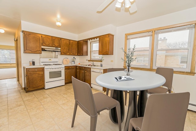 kitchen with sink, white appliances, and ceiling fan