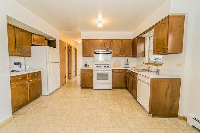 kitchen with a baseboard heating unit, sink, and white appliances