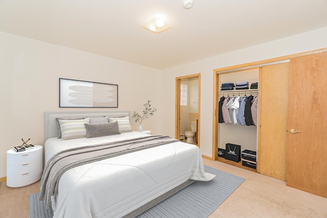 bedroom featuring a baseboard radiator, connected bathroom, carpet floors, and a closet