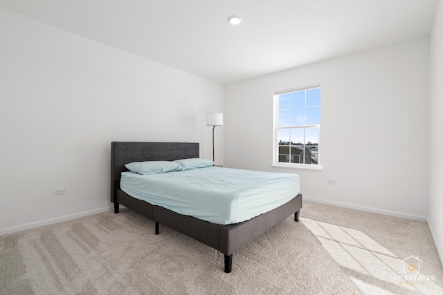 bedroom with light colored carpet