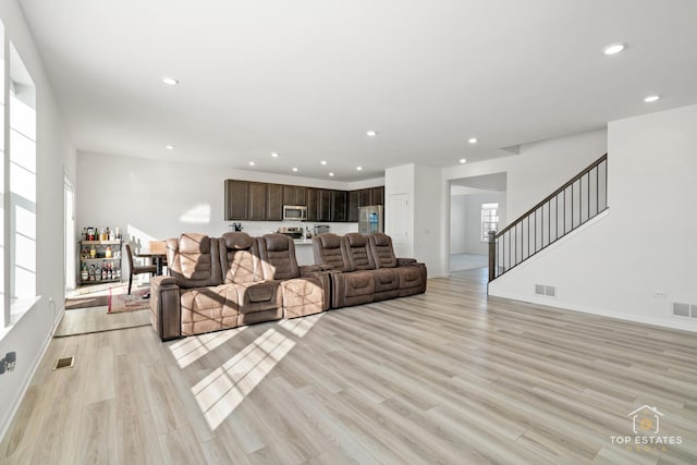 living room with light hardwood / wood-style floors