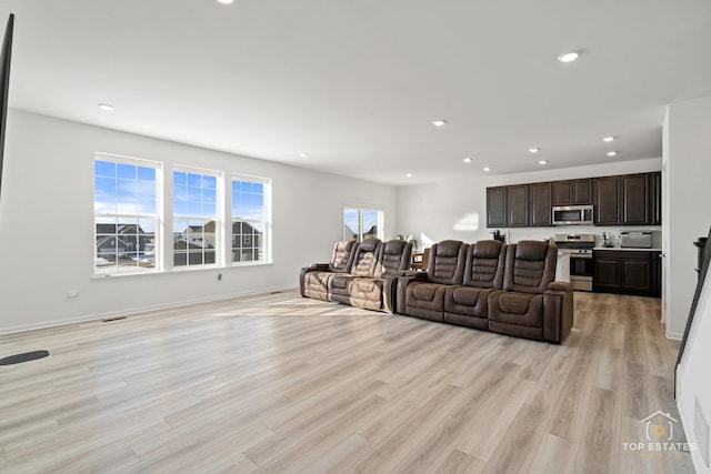 living room with light hardwood / wood-style floors