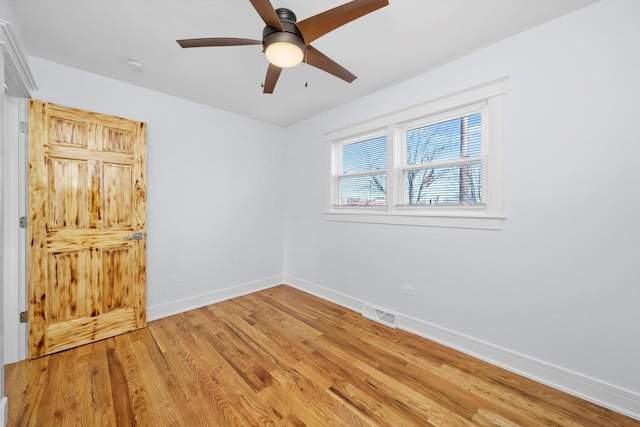 unfurnished room featuring hardwood / wood-style flooring and ceiling fan