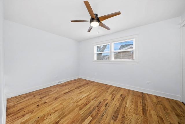 unfurnished room with hardwood / wood-style floors and ceiling fan