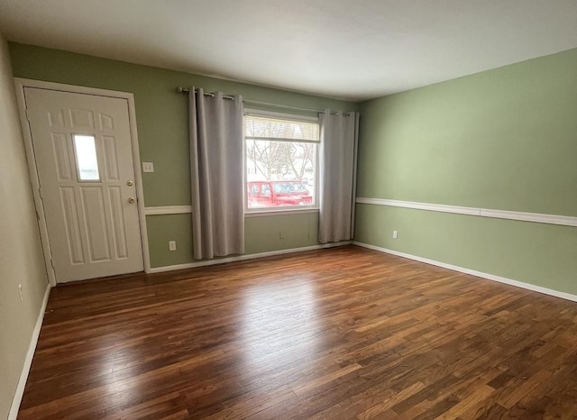 entryway with dark wood-type flooring