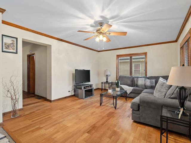 living room with crown molding, light hardwood / wood-style flooring, and ceiling fan