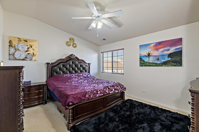 carpeted bedroom with lofted ceiling and ceiling fan