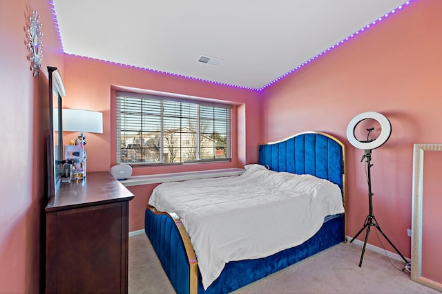 bedroom featuring light carpet